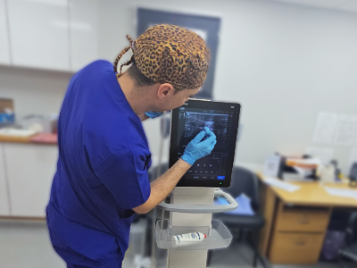 Scott the podiatrist using the ultra sound machine