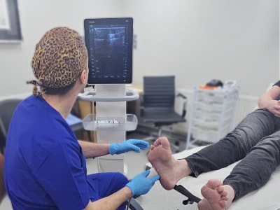 scott using the ultrasound on a foot