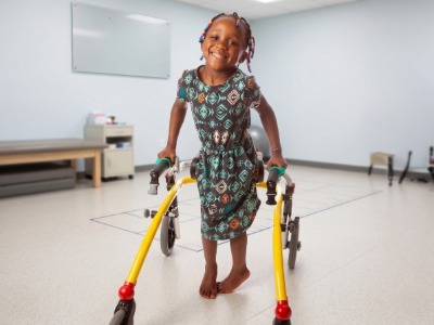 girl with cerebral palsy and a walker