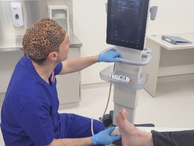 scott the podiatrist with a ultrasound machine